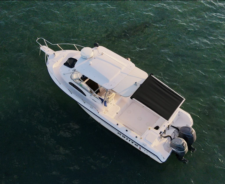 BocaShade Express Boat Shade black at the back of the boat