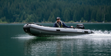 Load image into Gallery viewer, Man cruising with the Swellfish Classic 350 Inflatable Boat (11&#39;6&quot;)
