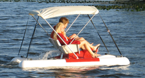 man and woman riding the Adventure Glass Pontoon Paddle Boat
