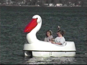 Adventure Glass Pelican Classic 2 Person Paddle Boat with two women on board