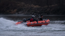 Load image into Gallery viewer, Men riding the Swellfish Inflatable Rescue Boat