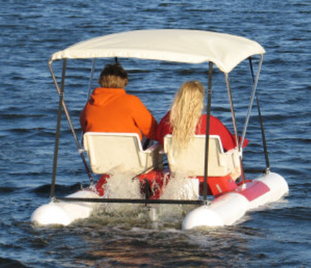 couple riding the Adventure Glass Pontoon Paddle Boat