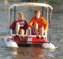 Load image into Gallery viewer, two people having fun riding the Adventure Glass Pontoon Paddle Boat