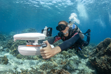 Load image into Gallery viewer, Diver underwater with the Sublue WhiteShark Tini Underwater Scooter