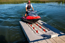 Load image into Gallery viewer, Man docking his jet ski into the Connect-A-Port PWC Floating Dock XL5