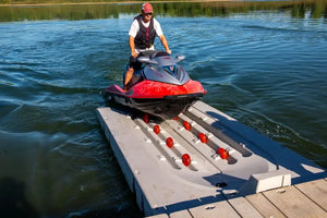 Man docking his watercraft into Connect-A-Dock Port PWC Floating Docks - XL5 