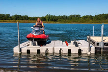 Load image into Gallery viewer, Woman docking her jet ski into the Connect-A-Port PWC Floating Dock XL5 