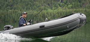 Man cruising the lake with the Swellfish Classic 430 Inflatable Boat  (14'1")