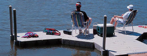 Man and woman relaxing on the Connect-A-Dock T Shape High Profile Docks - 2000 Series