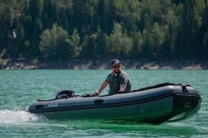 Man riding the Swellfish Classic 430 Inflatable Boat  (14'1")