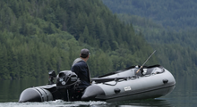 Load image into Gallery viewer, Man riding the Swellfish Classic 350 Inflatable Boat (11&#39;6&quot;)