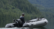 Man ready to go fishing with the Swellfish Classic 430 Inflatable Boat  (14'1