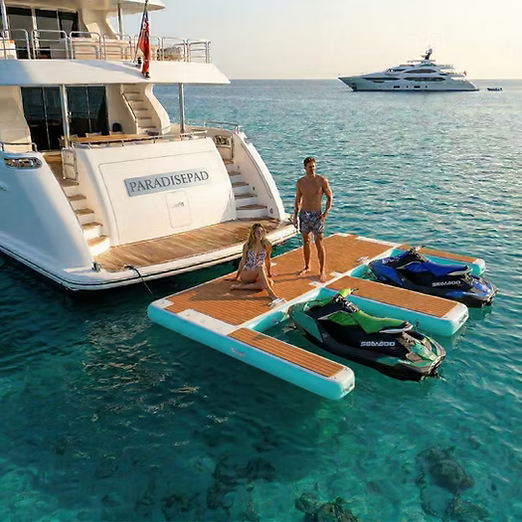 People on a ParadisePad Double Jet Ski  Inflatable dock attached to A Yacht