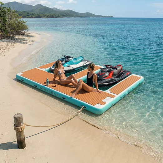 Two Women Sunbathing on a ParadisePad Double Jet Ski inflatable Dock.