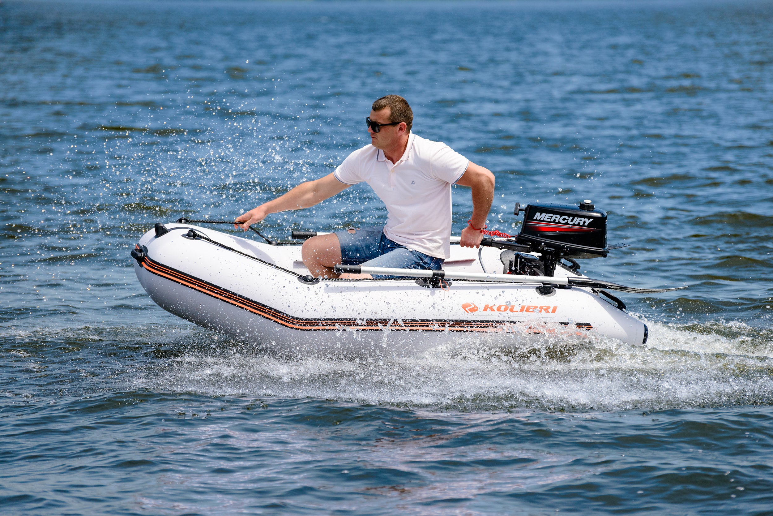 Man solo riding the Kolibri Marine KM-200 (6'7") Inflatable Boat
