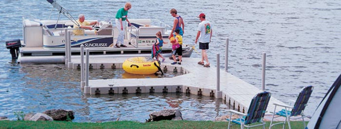 People preparing to board in the boat at the side of Connect-A-Dock F Shape High-Profile Docks