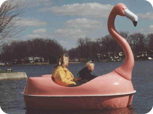 people riding the Adventure Glass Pink Flamingo Classic Paddle Boat
