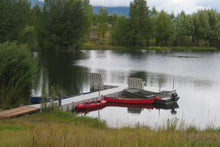 Load image into Gallery viewer, Connect-A-Dock T Shape Low-Profile Docks - 1000 Series installed in a lake with kayaks on the side