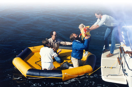 Four adults and one baby ready to board the Switlik MRP-10 Inflatable Marine Rescue Platform
