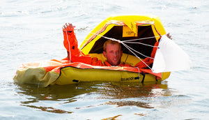 Switlik Inflatable Single Place Life Raft with man inside