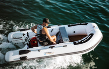 Load image into Gallery viewer, Man At The Helm Of The 10.8&#39; Inflatable Sports Boat Swordfish