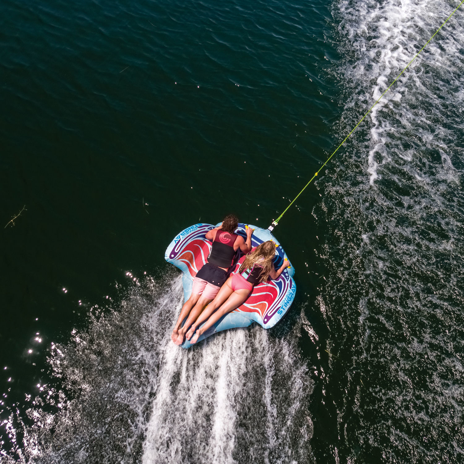 2 People Having Fun Riding On Connelly Stingray 2 Rider Towable