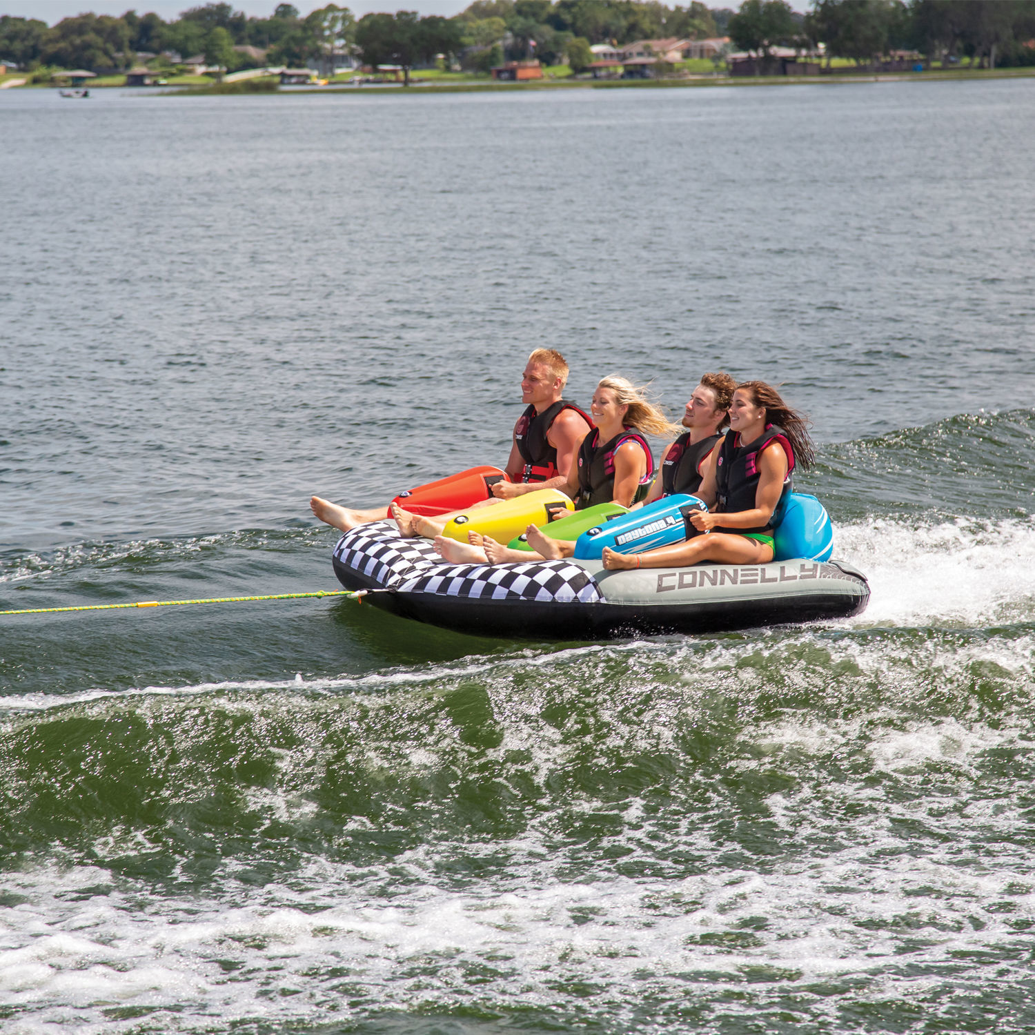 4 People Having Fun Riding On Connelly Daytona 4 Rider Towable