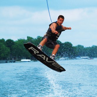A man wakeboarding using Rave Freestyle Orange Wakeboard  with Rave Boots