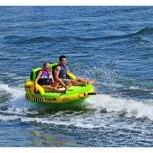 Load image into Gallery viewer, Rave #Stoked 2P Towable Tube being towed with 2 people riding on it