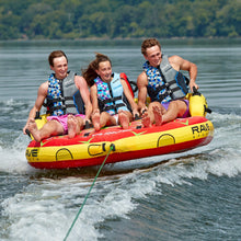 Load image into Gallery viewer, Rave #Epic 3P Towable Tube being towed with 3 people riding on it