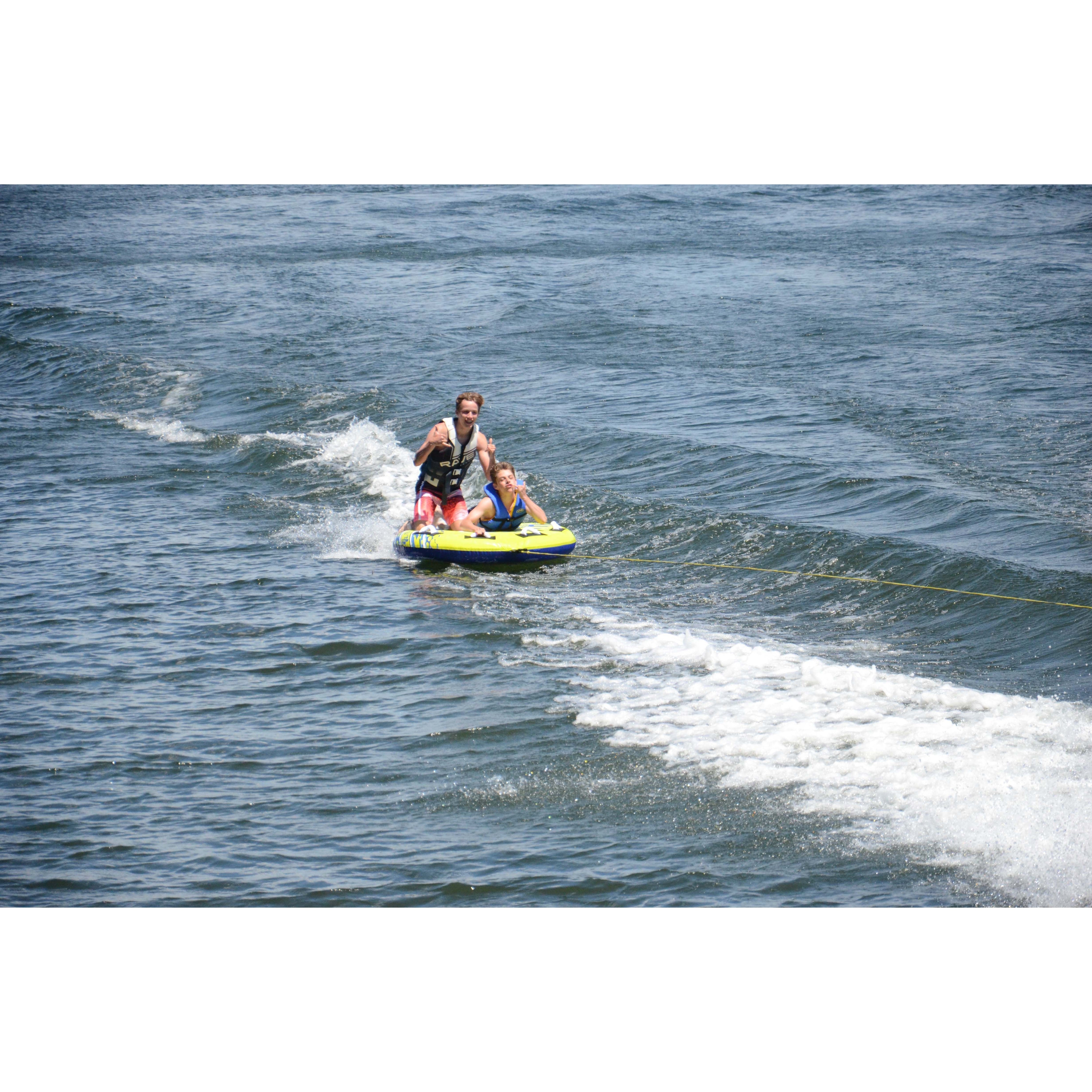 2 people riding in Rave Sports Halo 2 Rider Towable 02825