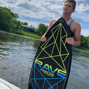 Rave Sports Fractal Wake Surf Board with a man holding on it.