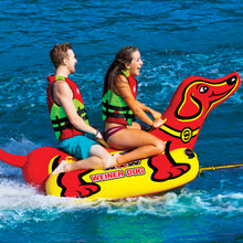 Load image into Gallery viewer, WOW Weiner Dog 2 Towable Tube being towed with 2 people riding it