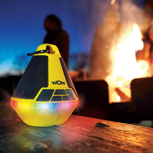 Yellow WOW sound buoy playing music with man in the background doing bonfire