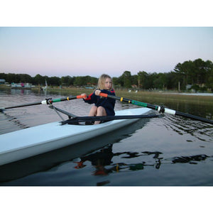 Boat - Kid learning how to row with the Little River Marine Regata Rowing Shell on calm water