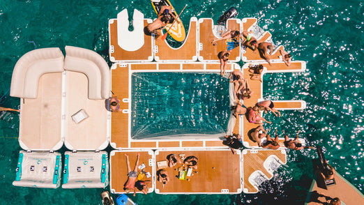 People having fun on the YachtBeach 6.20 Luxury Sea Pool 20' X 13'5" attached to other platforms
