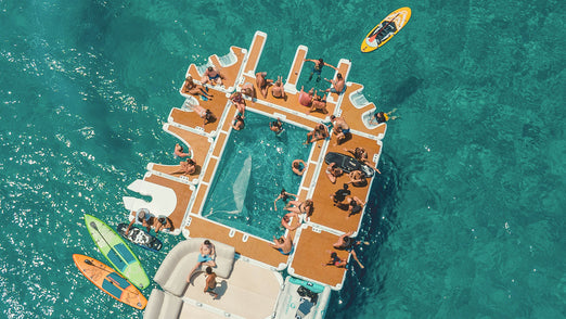 People having fun on the YachtBeach 6.20 Luxury Sea Pool 20' X 13'5" attached to other platforms