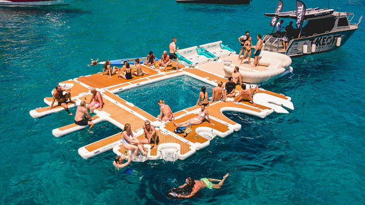 People having fun on the YachtBeach 6.20 Luxury Sea Pool 20' X 13'5" attached to other platforms