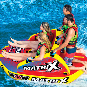 WOW Matrix 4P Towable Tube being towed with 2 women seating and 2 men kneeling at the back