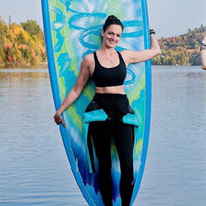 A girl holding Pulse The Logie Dayz 11' Rectech Board