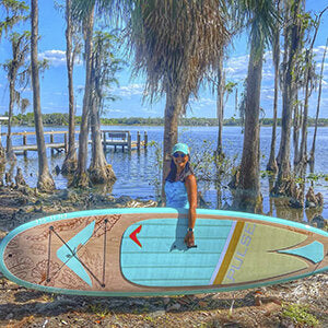 Woman carying Pulse The Seafoam 10'6" Tradisional SUP