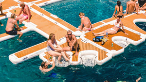 people hanging out on the YachtBeach Multi Dock & Lounger Double 2.05 and other platforms