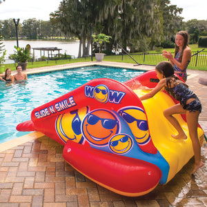 WOW's SSlide N Smile Single Lane Inflatable Pool Slide with 1 kids climbing the pool with a girl on the side
