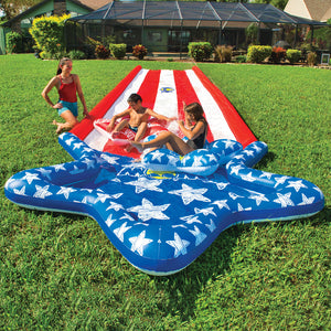 WOW Americana Stars & Stripes Inflatable Slide  with 2 kids sliding on it and 2 adult looking after them