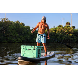 Inflatable stand up paddleboard - Man and a cooler boarding the Eco Outfitters Inflatable Stand Up Paddle Board 10'6