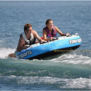 A man and a woman riding Rave Sports X-Frantic 3 Rider Towable 02407