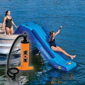 WOW Pontoon Waterfall Slide Inflatable Platform with a women slidding on it and 1 standing beside it with double action hand pump