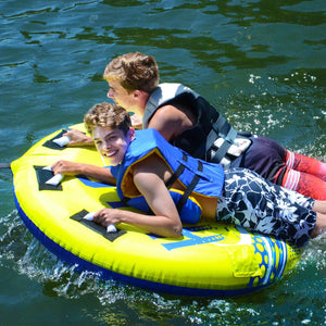 Side view of 2 kids riding in Rave Sports Halo 2 Rider Towable 02825
