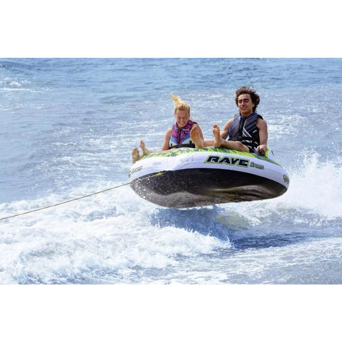 Man and woman riding Rave Sports Warrior II - 2 Rider Towable 02462