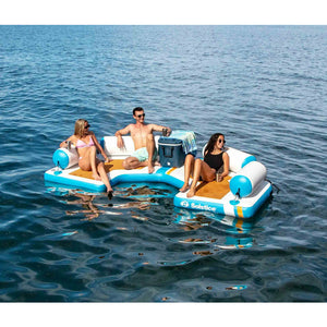 A group of friends chilling on Solstice Watersports 11' Inflatable Dock 38175